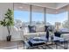 Sunlit living room with a comfortable sofa and stunning views at 41327 N 106Th St, Scottsdale, AZ 85262