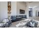 Living area features a modern fireplace and plenty of natural light at 41327 N 106Th St, Scottsdale, AZ 85262