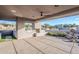 Outdoor kitchen with built-in grill and fireplace under covered patio at 41327 N 106Th St, Scottsdale, AZ 85262