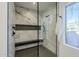 Walk-in shower with marble walls and hexagonal floor tiles at 41327 N 106Th St, Scottsdale, AZ 85262