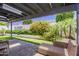 Inviting backyard with a covered patio, lush greenery, and well-manicured landscaping at 8094 E Via Del Vencino --, Scottsdale, AZ 85258