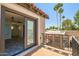 Private balcony featuring views of a lush yard with palm trees and tile roof at 8094 E Via Del Vencino --, Scottsdale, AZ 85258