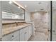 Elegant bathroom with granite counters, white cabinets, and luxurious tile shower at 8094 E Via Del Vencino --, Scottsdale, AZ 85258