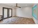 Bright bedroom with wood flooring, modern accent wall, and access to the outdoors at 8094 E Via Del Vencino --, Scottsdale, AZ 85258