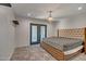 Comfortable bedroom featuring a chandelier, neutral walls, and a door leading to the patio at 8094 E Via Del Vencino --, Scottsdale, AZ 85258