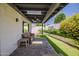 Relaxing covered patio with comfortable seating and view of the landscaped backyard at 8094 E Via Del Vencino --, Scottsdale, AZ 85258