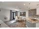 Dining area features an adjacent granite kitchen island and modern decor at 8094 E Via Del Vencino --, Scottsdale, AZ 85258