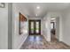 Bright foyer featuring new flooring, contemporary art, and a view into other rooms at 8094 E Via Del Vencino --, Scottsdale, AZ 85258