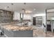 Bright kitchen featuring granite countertops, stainless steel appliances, and decorative backsplash and lighting at 8094 E Via Del Vencino --, Scottsdale, AZ 85258