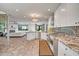 The open floor plan showcases the spacious kitchen with stainless steel appliances and granite countertops at 8094 E Via Del Vencino --, Scottsdale, AZ 85258