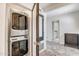 Convenient laundry area with modern stacked washer and dryer and stylish doorway access at 8094 E Via Del Vencino --, Scottsdale, AZ 85258