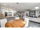 Spacious kitchen and living area with granite counter, modern decor, and glass staircase at 8094 E Via Del Vencino --, Scottsdale, AZ 85258