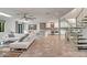 Open floor plan that features modern staircase, a view to the dining area, and seamlessly connects the kitchen at 8094 E Via Del Vencino --, Scottsdale, AZ 85258
