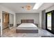 Bedroom with skylight, ensuite bath, walk-in closet, sliding door and modern decor for a serene retreat at 8094 E Via Del Vencino --, Scottsdale, AZ 85258