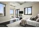 Bright main bedroom with dark wood floors, sitting area, and view windows allowing for plenty of natural light at 6112 E Quartz Mountain Rd, Paradise Valley, AZ 85253
