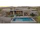 Inviting backyard features a sparkling pool, lounge chairs, and outdoor dining with scenic mountain views at 36421 N 105Th Pl, Scottsdale, AZ 85262