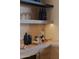 Stylish home bar featuring marble countertops, open shelving, and modern barware at 36421 N 105Th Pl, Scottsdale, AZ 85262