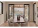 Bright dining area with mountain views, and an outdoor view to an inviting pool at 36421 N 105Th Pl, Scottsdale, AZ 85262