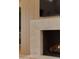 Modern fireplace with stone surround, wood paneling, and a mounted television above at 36421 N 105Th Pl, Scottsdale, AZ 85262