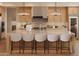 Gourmet kitchen features an island with seating, modern appliances, and stylish finishes at 36421 N 105Th Pl, Scottsdale, AZ 85262