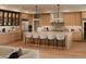 Modern kitchen with stainless steel appliances, sleek countertops, and a spacious island with seating at 36421 N 105Th Pl, Scottsdale, AZ 85262