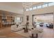 Open-concept living room featuring high ceilings, modern furnishings, seamless indoor-outdoor living at 36421 N 105Th Pl, Scottsdale, AZ 85262