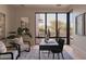 Bright home office featuring a large window with views, stylish decor, and comfortable seating at 36421 N 105Th Pl, Scottsdale, AZ 85262