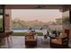 Outdoor patio features mountain views, outdoor seating and a pool with lounge chairs at 36421 N 105Th Pl, Scottsdale, AZ 85262