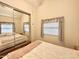 Bedroom view with large closet, warm colors, and natural light at 1044 S Quartz Dr, Apache Junction, AZ 85119