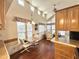 Bright dining area featuring large windows, high ceilings, and hardwood flooring at 1044 S Quartz Dr, Apache Junction, AZ 85119