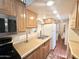 Kitchen features stainless microwave, updated cabinets, and lots of counter space at 1044 S Quartz Dr, Apache Junction, AZ 85119