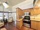 Kitchen includes stainless appliances, plenty of counter space, and wood-look floors at 1044 S Quartz Dr, Apache Junction, AZ 85119