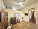 Spacious living room featuring a lofted space, unique flooring, and a ceiling fan at 1044 S Quartz Dr, Apache Junction, AZ 85119