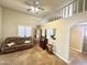 Open living room with unique flooring, lots of light, ceiling fan and lofted space at 1044 S Quartz Dr, Apache Junction, AZ 85119