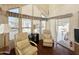 Relax in this cozy living area with high ceilings and a view of the outdoors at 1044 S Quartz Dr, Apache Junction, AZ 85119