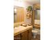 Bathroom showcasing vanity with marble countertop, toilet, decorative plant, and bath with shower at 8103 E Southern Ave # 24, Mesa, AZ 85209