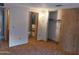 Cozy bedroom with a door leading to an adjacent bathroom and a walk-in closet at 8103 E Southern Ave # 24, Mesa, AZ 85209