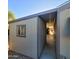 Side view of the building with an attached carport and landscaped rocks at 8103 E Southern Ave # 24, Mesa, AZ 85209