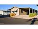 Charming single-story home with carport and manicured landscaping at 8103 E Southern Ave # 24, Mesa, AZ 85209