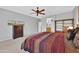 Bright bedroom with a king-size bed and en-suite bathroom at 17156 W Lachlan Ct, Surprise, AZ 85387