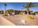 Single-story home with desert landscaping and two-car garage at 17156 W Lachlan Ct, Surprise, AZ 85387