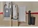 Interior garage view of water heater and HVAC unit at 17156 W Lachlan Ct, Surprise, AZ 85387