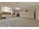Spacious garage with built-in cabinets and a utility sink at 17156 W Lachlan Ct, Surprise, AZ 85387