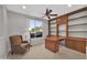 Home office features built-in shelves and a large desk at 17156 W Lachlan Ct, Surprise, AZ 85387
