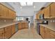 Kitchen with light wood cabinets, tile backsplash and stainless steel appliances at 17156 W Lachlan Ct, Surprise, AZ 85387