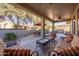 Spacious covered patio with comfortable seating at 17156 W Lachlan Ct, Surprise, AZ 85387