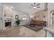 Living room with a fireplace, tiled floors and brown leather couch at 7291 N 71St Pl, Paradise Valley, AZ 85253