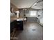 Functional kitchen with gray cabinets, white appliances, and dining area, ready for culinary adventures at 3330 E Main St # 9, Mesa, AZ 85213