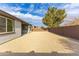 Wide angle view of backyard with gravel, house and fence at 17463 N 66Th Ave, Glendale, AZ 85308