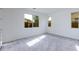 Spacious bedroom featuring neutral carpet, natural light, and ample closet space at 17463 N 66Th Ave, Glendale, AZ 85308